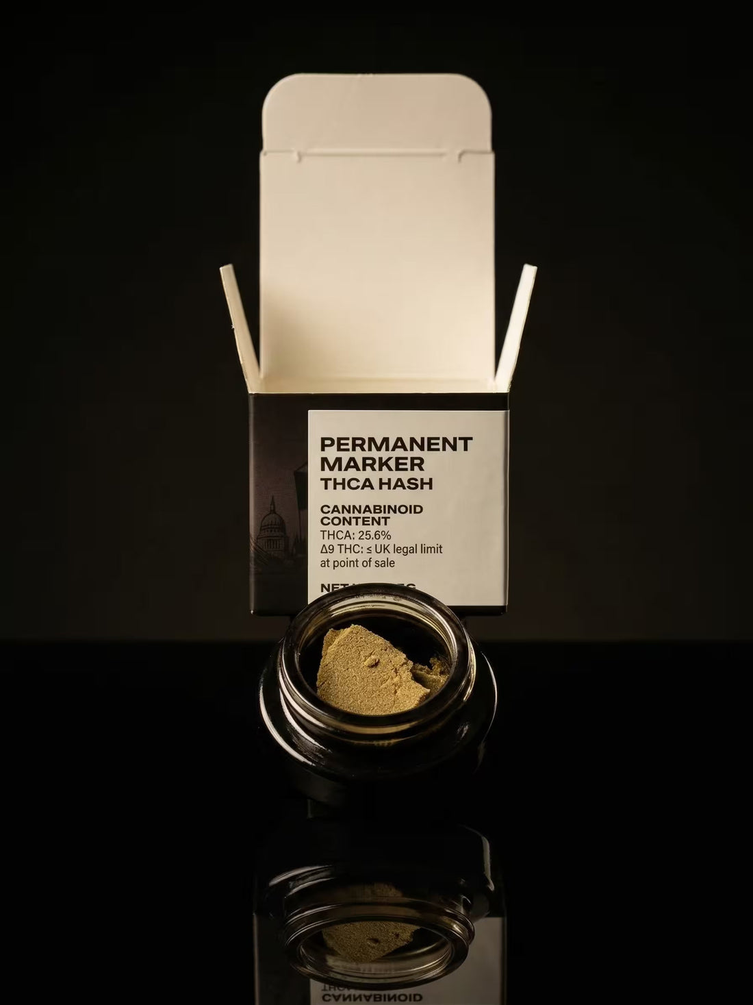 Permanent Marker Hash in a black jar with a branded box behind on a black background.