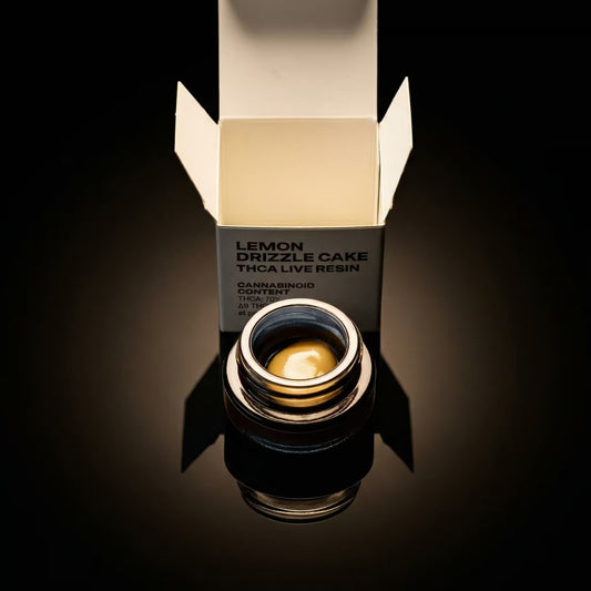 thca concentrate container with 'Lemon Drizzle Cake' label on a reflective surface.